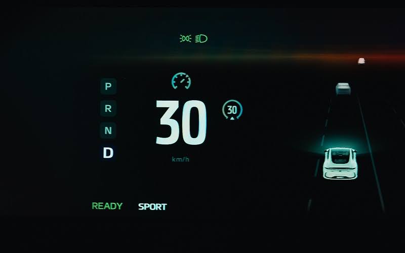 Electric car digital dashboard displaying speed and sport mode.