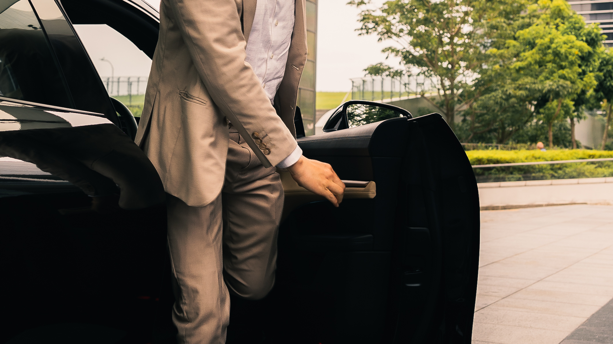 business man alighting car