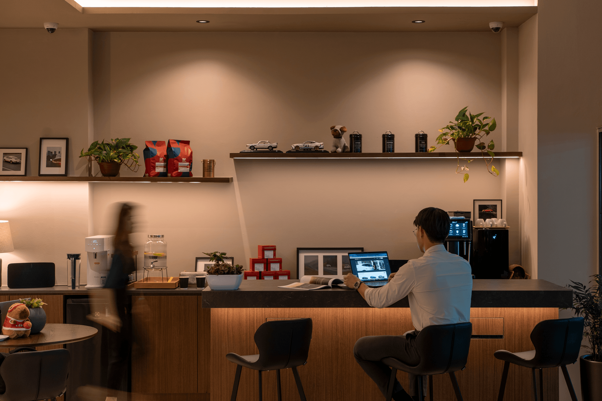 Warm and inviting lounge space where customers can work, relax, and enjoy a cup of coffee.