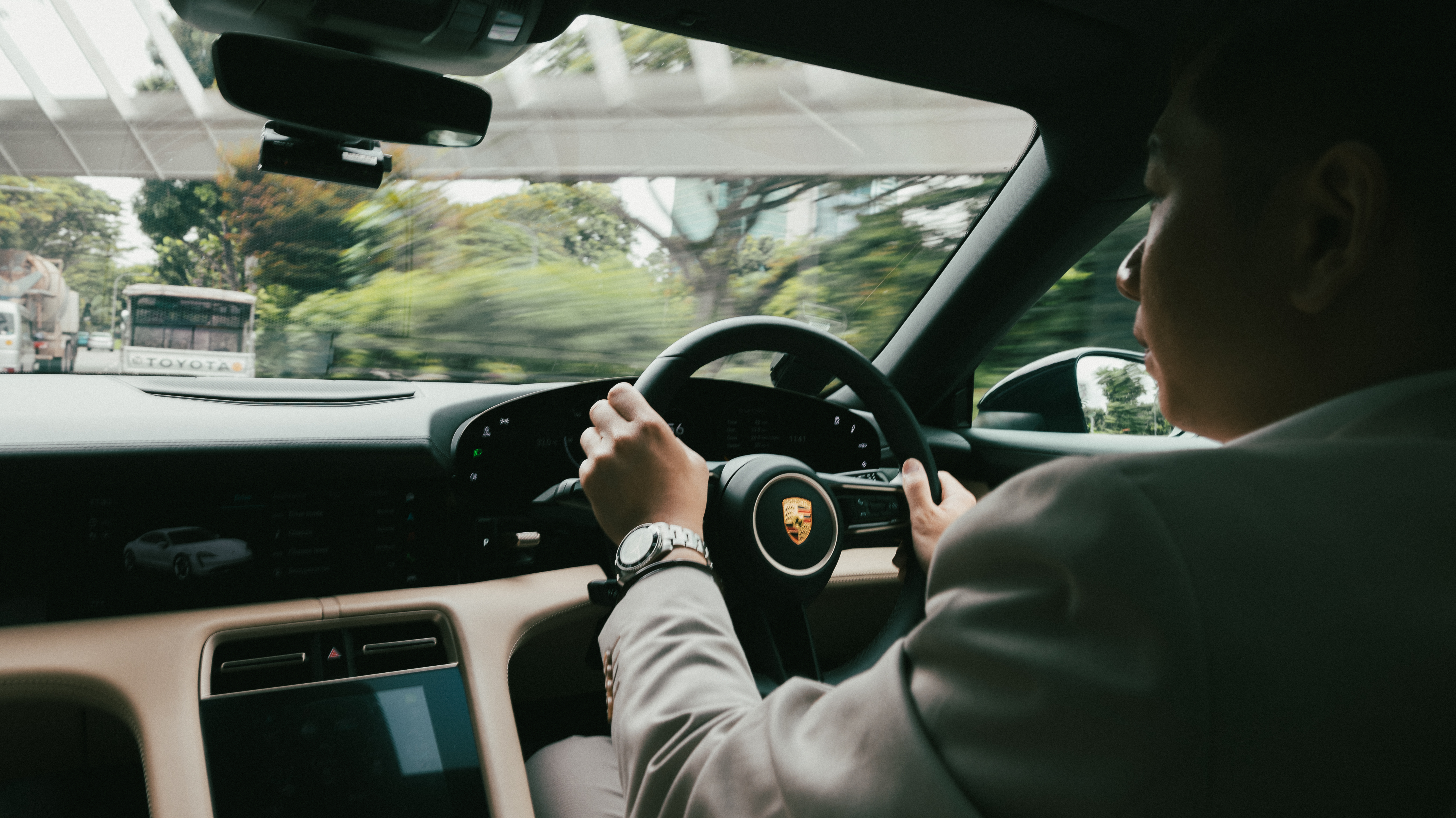 expat driving a rental car on highway